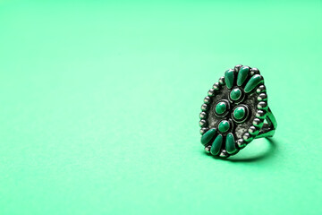 Beautiful ring on green background