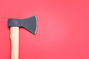 Ax on red background, top view