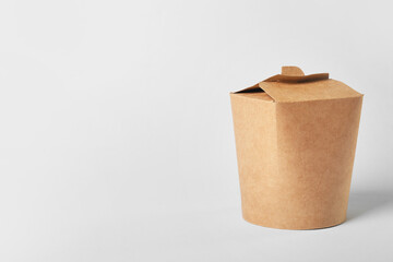 Carton box with Asian food on light background