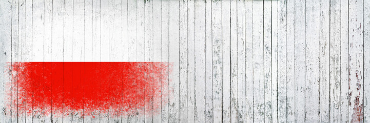 Flag of Poland. Flag is painted on a white wooden surface. Wooden background. Plywood surface. Copy...