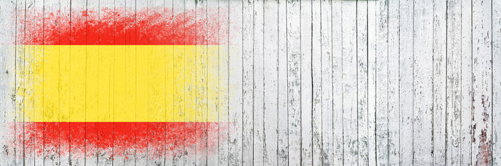 Flag of Spain. Flag is painted on a white wooden surface. Wooden background. Plywood surface. Copy space. Textured background