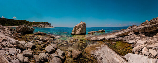 Panoramic beach, rocks and sea