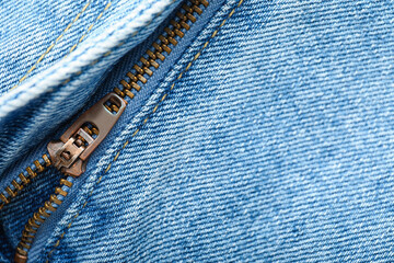 Closeup view of metal zipper on denim clothes