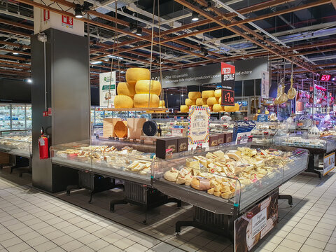 Bergamo, Italy - April 29, 2022: Food selection in Italian Iper supermarket. Cheese display. Italian grocery shop display.