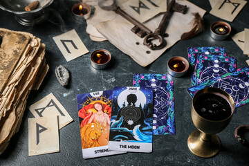 Magic attributes of fortune teller on dark table