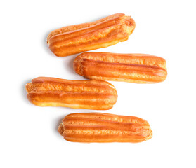 Delicious sweet eclairs on white background