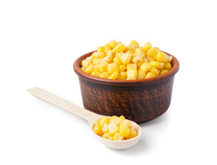 Bowl of canned corn and wooden spoon isolated on white background