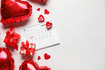Calendar with marked date of Valentine's Day, candles, balloons and gifts on white background