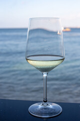 A glass of wine in a sea view restaurant