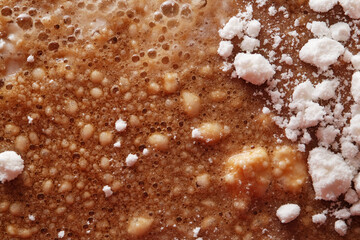 Mixture of coconut powder on cola drink