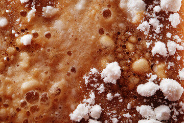 Mixture of coconut powder on cola drink
