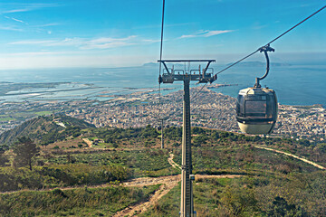 Gondola of the cable car from Trapani to Erice in the west of Sicily. There is a cableway connection between the towns.  - obrazy, fototapety, plakaty
