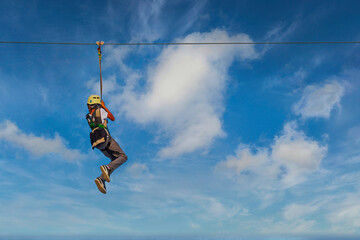 woman zip line over sea in Bournemouth England 