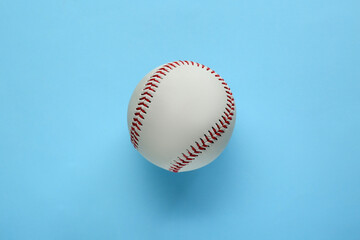 Baseball ball on light blue background, top view. Sports game