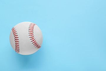 Baseball ball on light blue background, top view with space for text. Sports game
