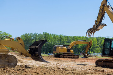 Heavy construction equipment works on construction area site