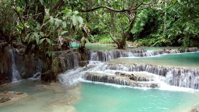 Beautiful Clear Waterfall Cascade In Tropical Rainforest, Kuang Si Falls In Luang Prabang, Laos
