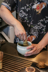Fototapeta na wymiar Bamboo whisk matcha green tea brush as a stirrer. Traditional Japanese tea ceremony. Tea accessories concept.