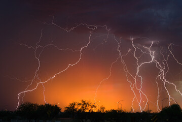 Naklejka na ściany i meble Fort Huachuca Layered LightningLightning can occur at anytime and anywhere, before and after a storm. The Arizona monsoon is characterized by heavy rain, dust storms and lightning. It is a symbol o