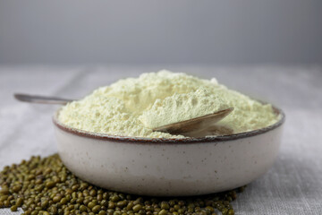 Bowl of flour and mung beans on light grey table