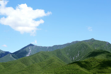 Fototapeta premium Picturesque view of beautiful mountains and blue sky