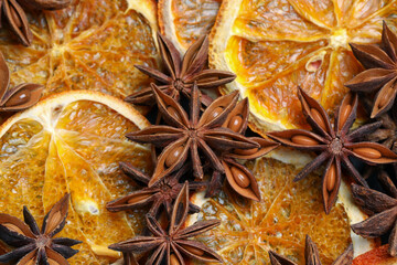 Dry orange slices and anise stars as background, closeup