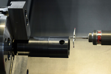 The modular touch probe checking the tube parts on CNC lathe machine.
