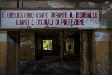 A danger sign in an abandoned factory