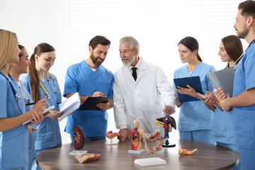 Doctor giving lecture for interns in university