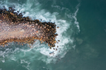 waves breaking on rocks