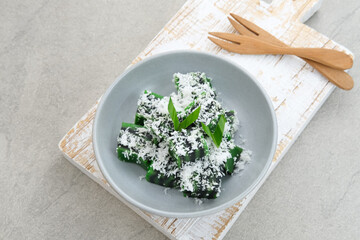 Kue Jongkong layer cake with grated coconut, Indonesian traditional snack
