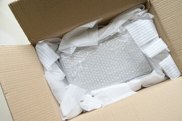 white wrap bubble put in brown box