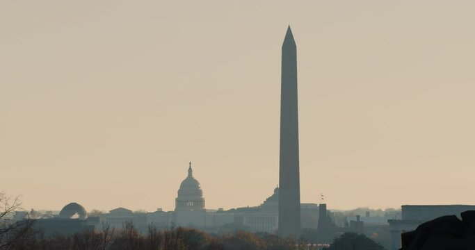 Washington Monument And U.S. Capitol Building In Silhouette At Sunrise