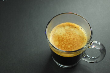 black coffee on black table, beverage in the morning
