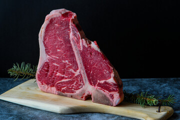 Thick Raw T-Bone or porterhouse Steak on the kitchen table