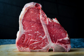 Thick Raw T-Bone or porterhouse Steak on the kitchen table