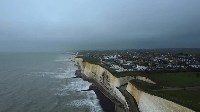 Dramatic storm on coast of England with cliffs and dark grey clouds