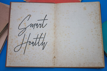 Smart Health word in opened book with vintage, natural patterns old antique paper design.