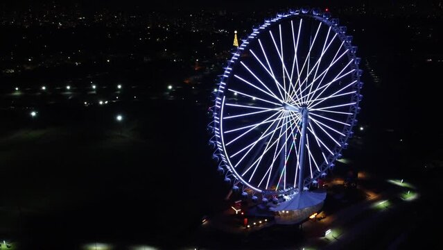 SÃO PAULO, BRAZIL DECEMBER 26, 2022 Aerial Photography Aerial view of the largest Ferris wheel in Latin America. Officially called Roda Rico it is working in Parque Cândido Portinari, next to Parqu