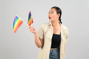 Pretty woman LGBQ pose with muli-color flag