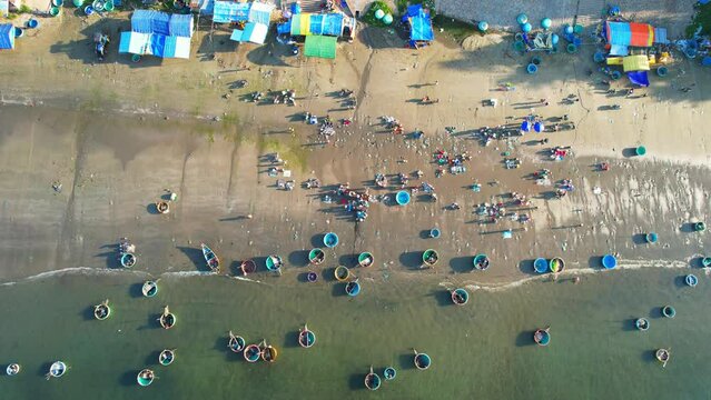 Aerial view of the morning fish market in a coastal fishing village Mui Ne, Vietnam. They buy and sell seafood for the central provinces of Vietnam
