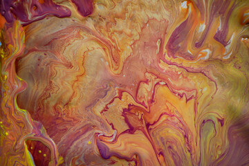 Waves of gold and purple paint. Abstract fluid painting. Texture splash