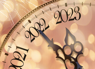 clock face on a Christmas background. the year 2023 is coming soon. the concept of the new year.