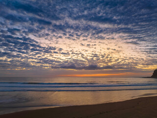 Fototapeta na wymiar Beautiful sunrise with clouds over the ocean