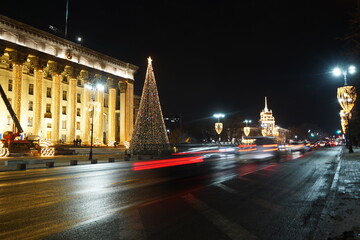 Fototapeta na wymiar Almaty, Kazakhstan - 12.22.2022 : The central streets of the city are decorated with Christmas tree toys, garlands and tinsel.