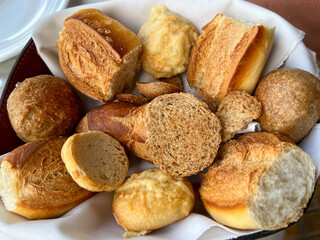 Basket of breads at urban restaurant welcomes travelers to a hearty meal
