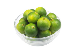 Fresh calamansi lime fruits in glass bowl isolated on white background.	