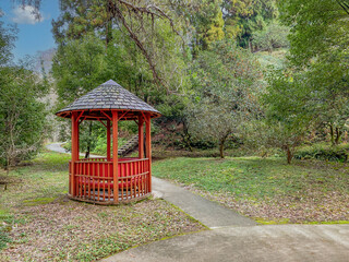 autumn: wooden gazebo in park