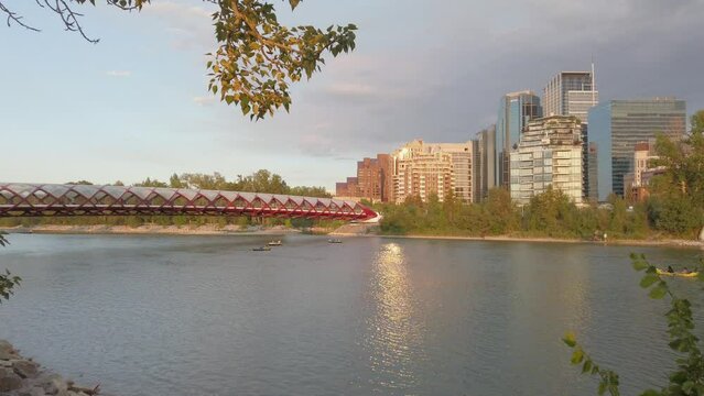 Boats in Bow River by Peace bridge Calgary downtown Alberta Canada