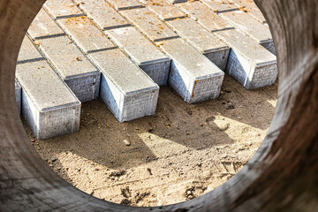 Pavement repair and laying of paving slabs on the walkway, stack